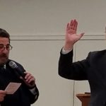 Being sworn in by D16 Commander Matt Lombardi