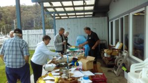 Members browse the Silent Auction for some great buys for useful boating items donated by members