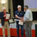 Gary Hicks being presented Certificates of successful completion of Marine COmmunications and