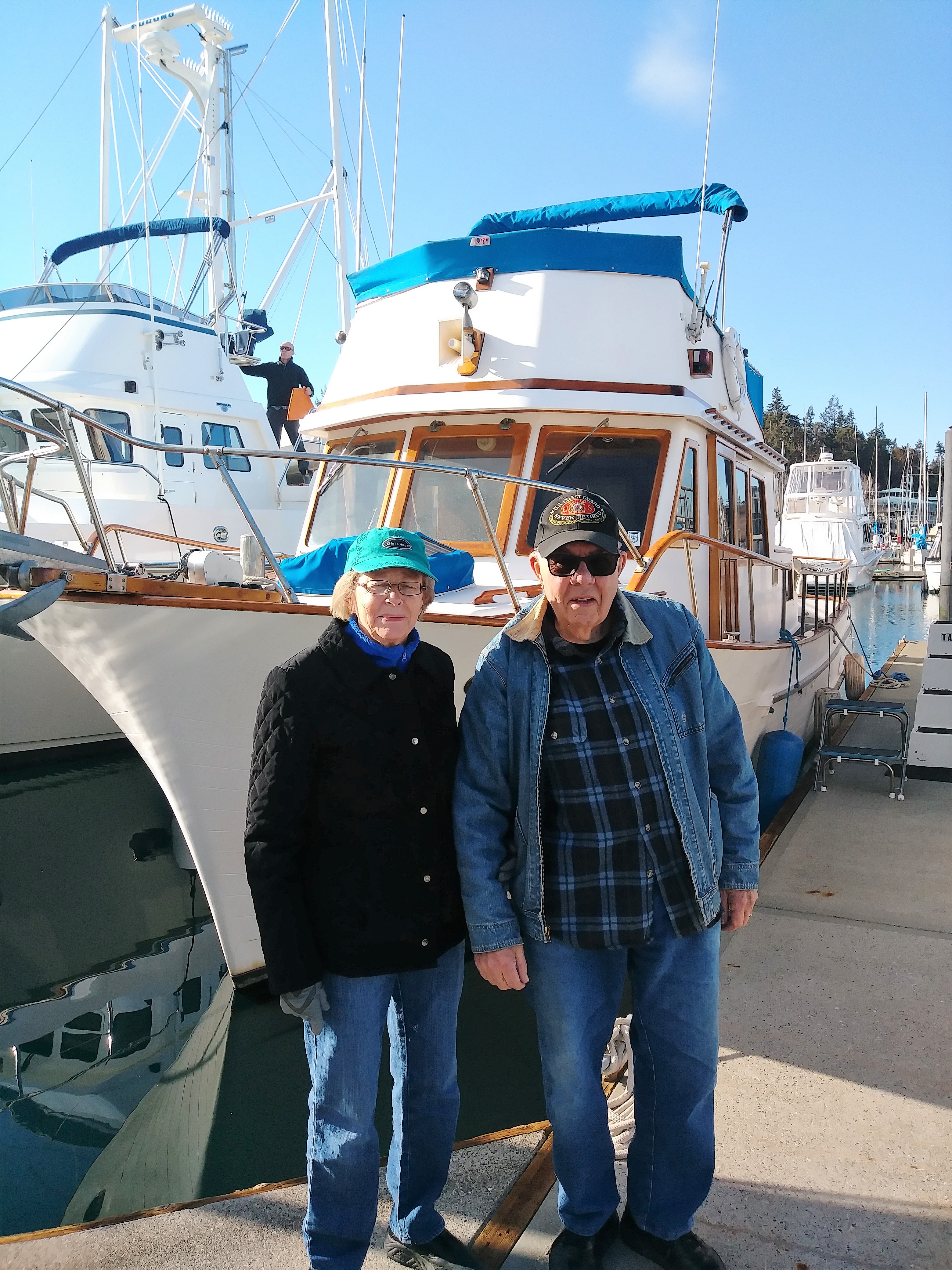 Grace & Dick Schoel by their new boat "Eagles Nest"